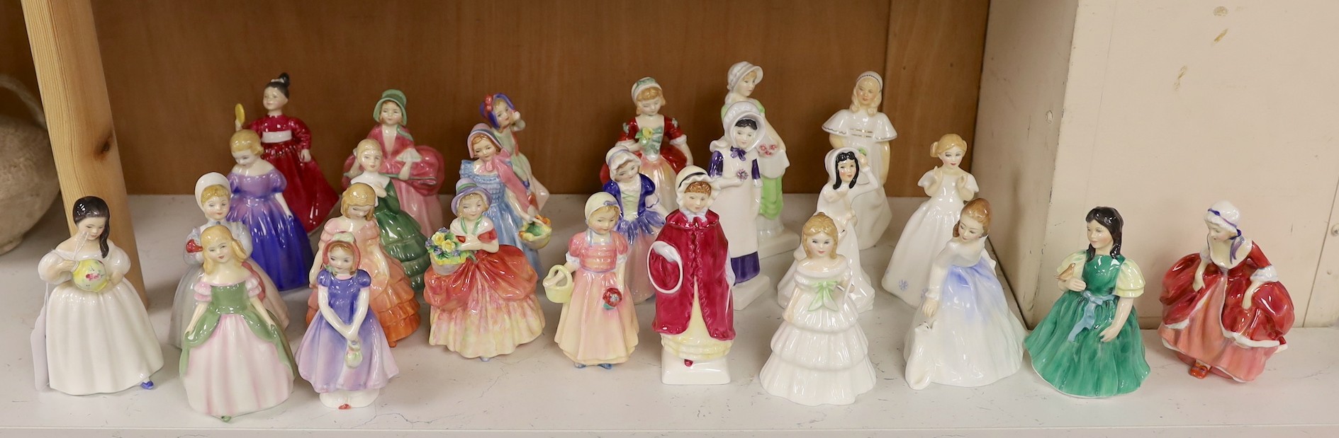 A collection of twenty five Royal Doulton figurines; Mandy, Penny, Ivy, the Rag Doll, Rose, Cissie, Tinkle Bell, Georgina, Julie, Andrea, Francine, Goody Two Shoes, Catherine, Helen, Anna, Dinky Do, Wendy, Belle, Marie,